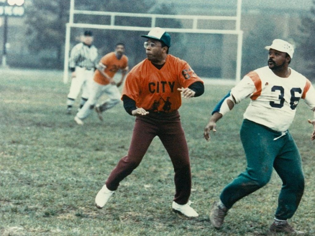Baltimore Mayor Kurt Schmoke in action at the 100th Anniversary City vs Poly Alumni Football Game in 1989. (City vs. Poly Alumni Football Game, 1989, PP278 [unprocessed], MdHS.)