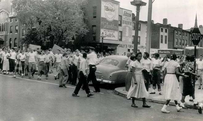Baltimore City Police officer seperates whites and negro students at Southern High School to prevent fighting, October 1, 1954. Baltimorecitypolicehistory.com (not MdHS image)