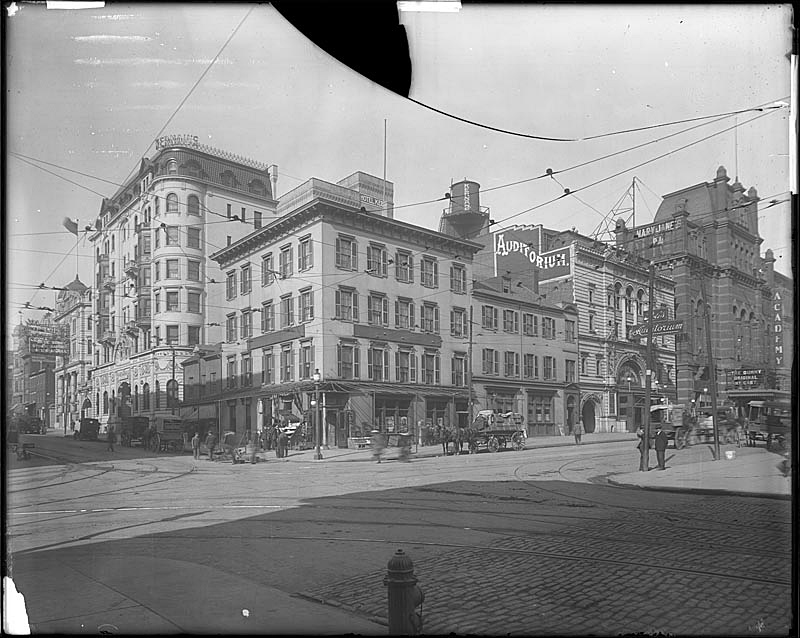 Howard Street and Franklin Street, ca. 1915 Shows The Auditorium Theatre (now Mayfair Theatre), Turkish Bath, Academy Hotel, Kernans Hotel (now The Congress apartments). Hughes Company, PP8, Z9.399.PP8, MdHS. Hughes Company Photograph Collection