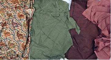 Uncatalogued remnants of silk gowns.  Elizabeth fashioned a workbag (59.92.15) using the fabric on the left for her great-niece, Alice Patterson Harris.  The bag is on display in the exhibition, MdHS Museum Collection. (Reference Photo)