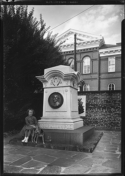 A slightly ghoulish image. A girl and her dog with Poe's remains. Poe's Memorial Grave, October 21, 1956, A. Audrey Bodine, B209-4, Baltimore City Life Museum Collection, MdHS.