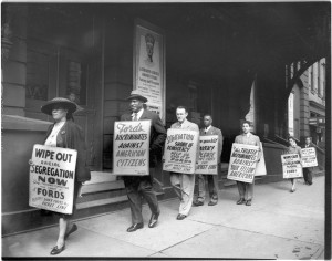 HEN.00.A2-156 Picket line. Protesting Jim Crow admission policy at Ford's Theatre, Baltimore.  Paul Robeson pictured second from left.  NAACP Baltimore Branch protest signs.  March, 1948.