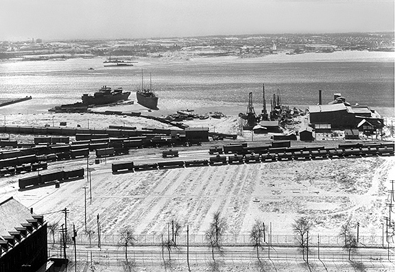 Each day, ships would arrive to unload freight into awaiting railcars. View from B&O Elevator, Locust Point, Baltimore, Port Covington in foreground, ca. 1932, A. Aubrey Bodine, B317, Baltimore City Life Museum Collection, MdHS. 