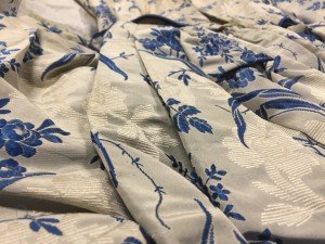 1949.94.1 Blue and white floral design on grey silk faille.