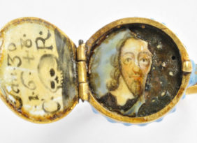 A locket with a portrait inside.